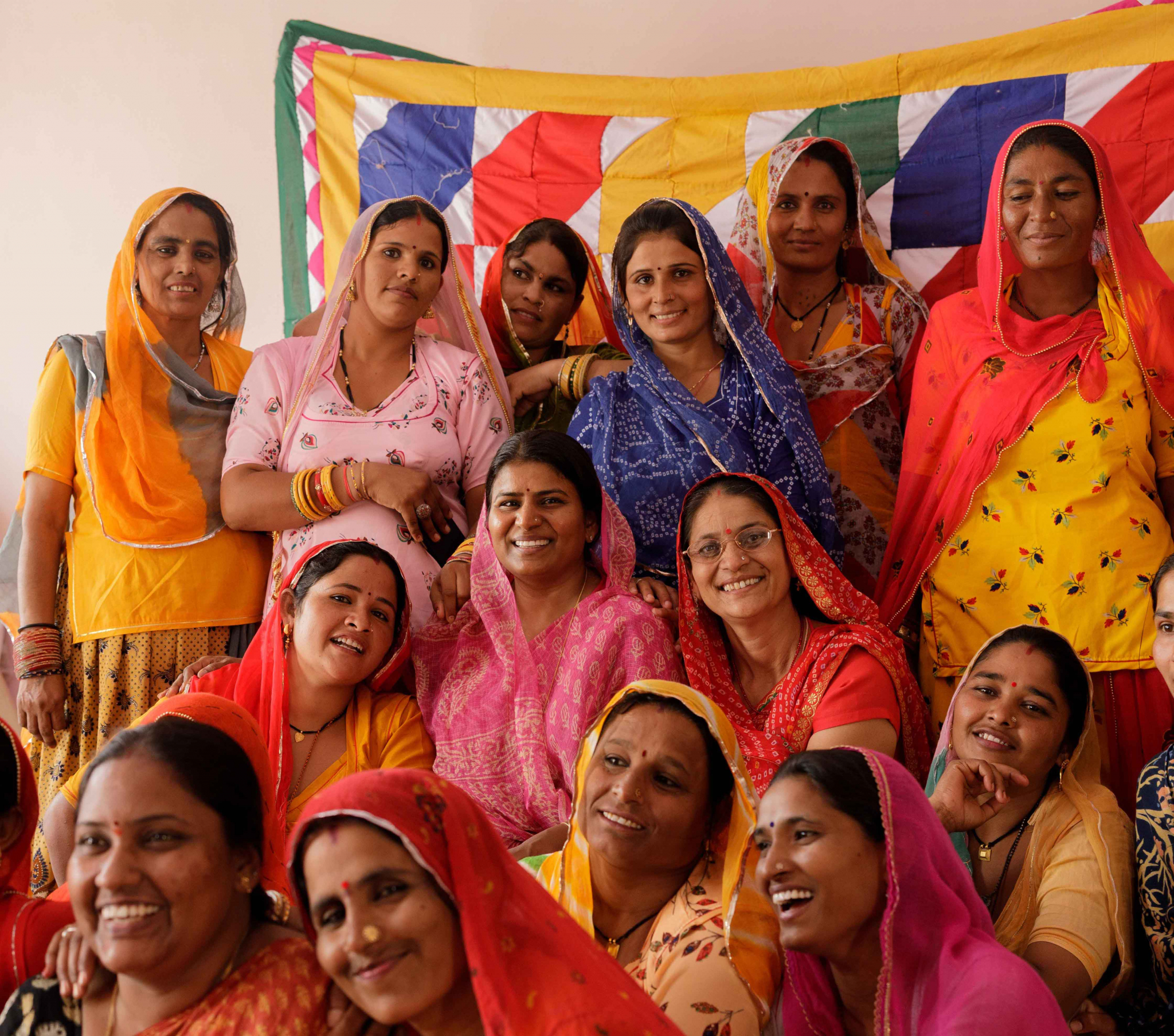 "Empowered women artisans from Saheli Women Organization sharing joy and laughter, united in their creativity and strength."